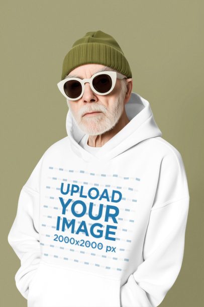Pullover Hoodie Mockup of an AI-Generated Bearded Cool Senior Man Standing in a Studio