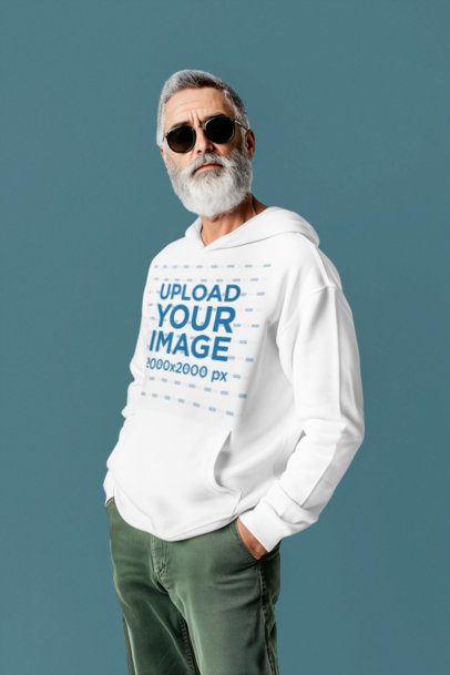 Hoodie Mockup Featuring an AI-Created Old Man With Beard and Sunglasses Posing in a Studio
