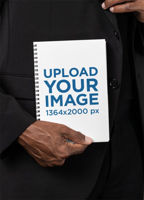 Mockup of a Man Holding a Spiral Notebook in a Corporate Setting
