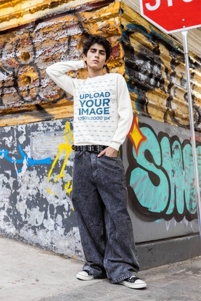 Comfort Colors Sweatshirt Mockup of a Man Standing Against a Graffiti Wall on a Sidewalk m55824