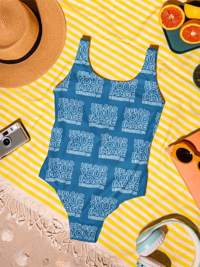 Mockup of a Sublimated Swimsuit Lying on a Summer Picnic Setting