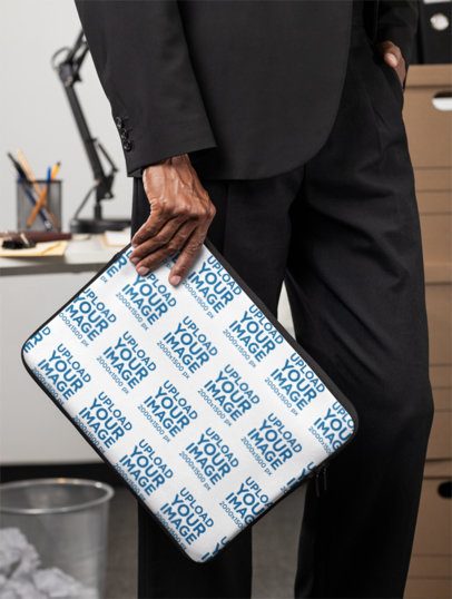 Mockup of a Man Holding a Laptop Sleeve While Standing in an Office m55729