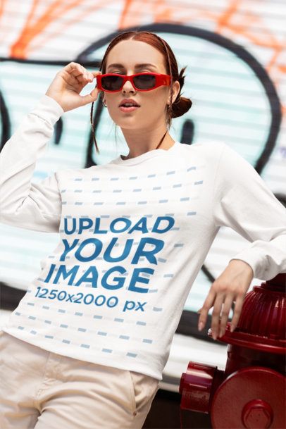 Comfort Colors Mockup of a Woman in a Long-Sleeve Tee Posing by the Street