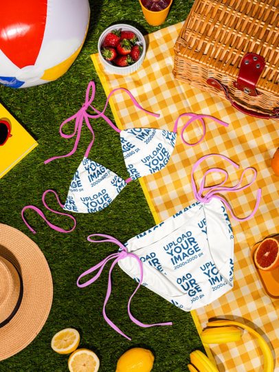 Mockup of a Bikini Lying on a Summer Picnic-Inspired Setting