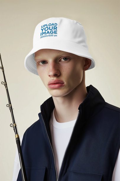 Bucket Hat Mockup of an AI-Generated Man Posing in a Studio With a Fishing Rod m55690