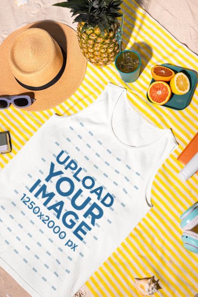 Comfort Colors Mockup of a Tank Top Lying on a Beach-Themed Setting