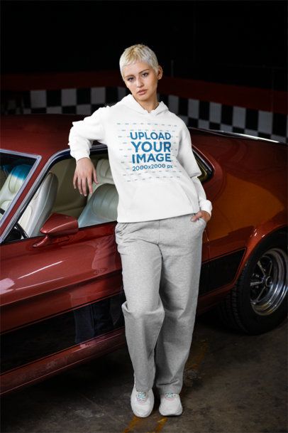 Comfort Colors Hoodie Mockup of a Woman Posing Against a Vintage Car m56270