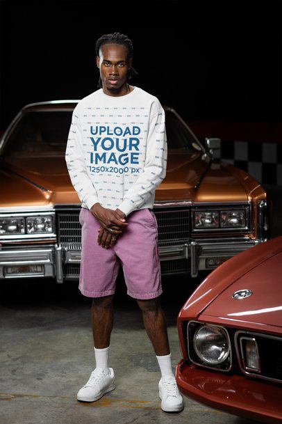Comfort Colors Mockup Featuring a Man in a Sweatshirt Posing in a Garage m56280
