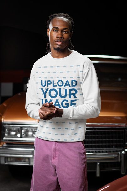 Comfort Colors Sweatshirt Mockup of a Man With a Serious Look Posing in a Garage m56281