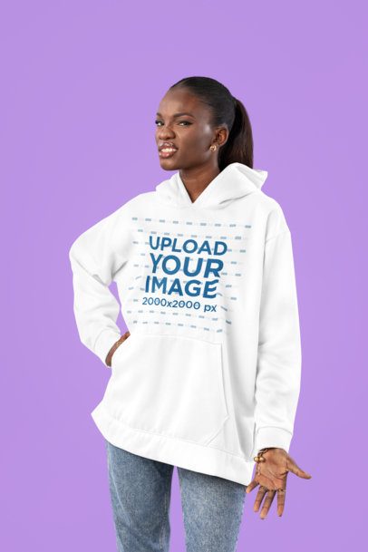 Hoodie Mockup Featuring a Woman Making  an Annoying Expression in a Studio
