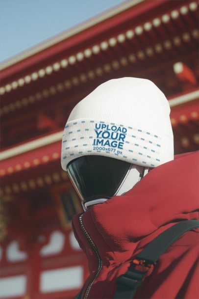 Beanie Mockup Featuring an AI-Created Robot Wearing a Winter Outfit