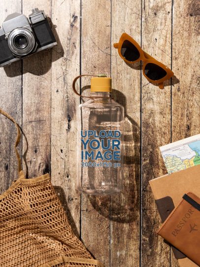 Nalgene Mockup Featuring a Water Bottle Lying on a Wooden Surface With Travel Stuff m55035
