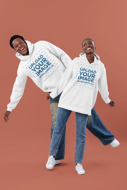 Pullover Hoodie Mockup of a Woman and a Man Having Fun in a Studio
