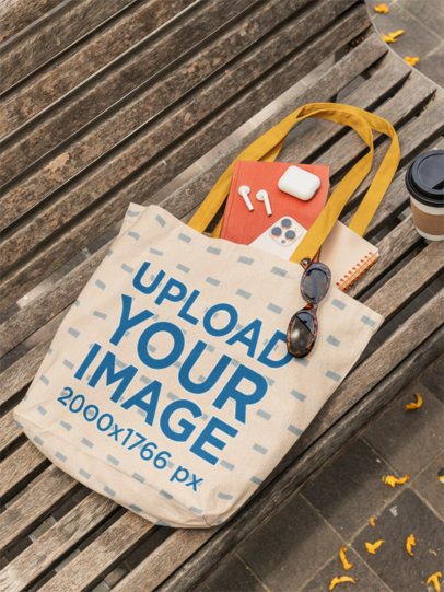Bagmasters Mockup Featuring a Tote Bag Lying on a Bench With Coffee and a Smartphone m56509