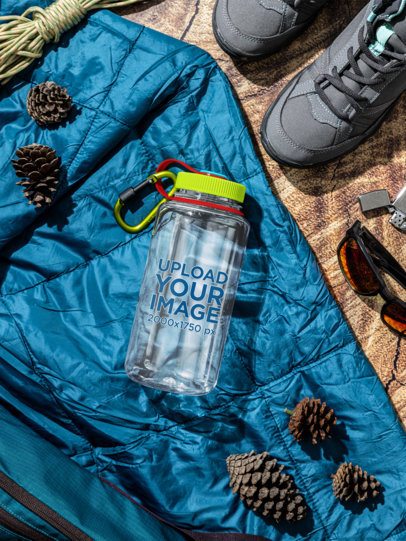 Mockup of a Nalgene Water Bottle Lying on a Travel-Themed Setting m55033