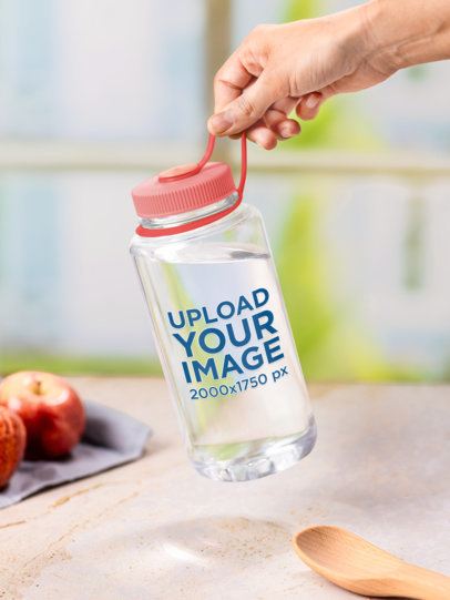 Mockup Featuring a Person Holding a Water Bottle in a Kitchen Setting m55042