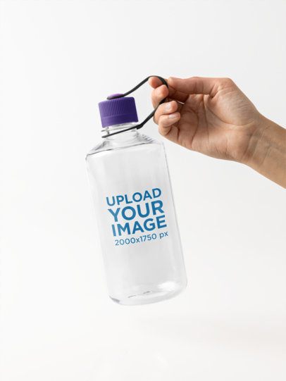 Mockup of a Man Holding a Nalgene Water Bottle in a Studio Setting m55023