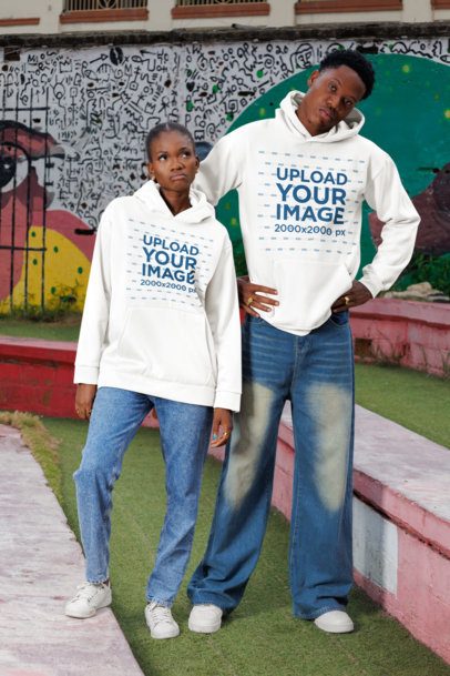 Hoodie Mockup Featuring a Woman and a Man Posing With Confused Expressions