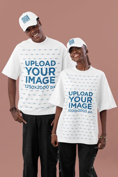 Dad Hat Mockup of a Smiling Man and a Woman Wearing Oversized T-Shirts in a Studio