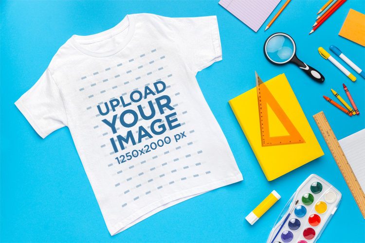 Gildan Mockup Featuring a T-Shirt Placed on a Background With School Supplies