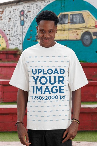 Oversized T-Shirt Mockup of a Man Making a Funny Expression in the Street