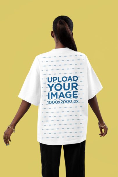Back-View Mockup Featuring a Woman in an Oversized T-Shirt Posing in a Studio