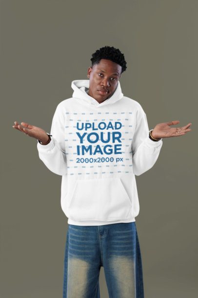 Pullover Hoodie Mockup of a Man Posing With a Confused Look in a Studio
