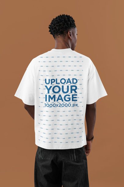 Oversized T-Shirt Mockup Featuring a Man Posing Backwards in a Studio