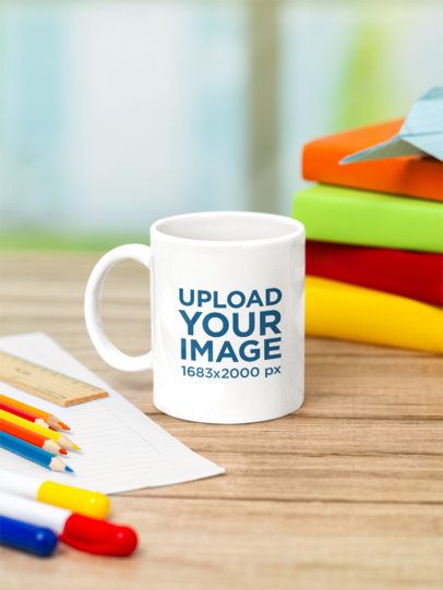Drinkware Mockup Featuring a Coffee Mug Placed on a Desk With Colors and School Supplies m56736