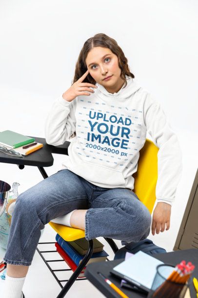 Comfort Colors Hoodie Mockup Featuring a Serious Young Woman in a School Setting m57179