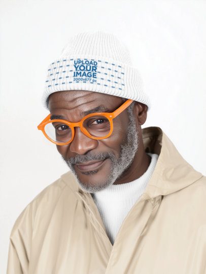 Beanie Mockup Featuring an AI-Created Bearded Senior Man Posing in a Studio With a Happy Look m54874