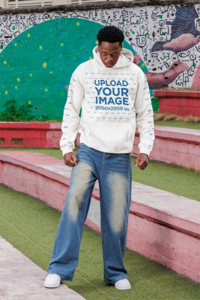 Pullover Hoodie Mockup of a Man Posing With an Angry Expression in the Street