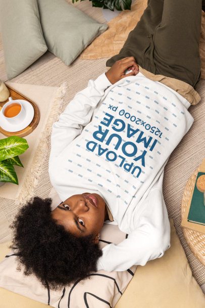 Comfort Colors Mockup of a Man Wearing a Sweatshirt While Lying on the Floor and Relaxing m56608