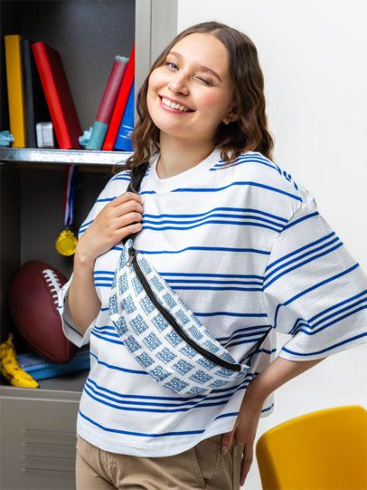 Fanny Pack Mockup Featuring a Young Woman Student Winking Near Some School Lockers