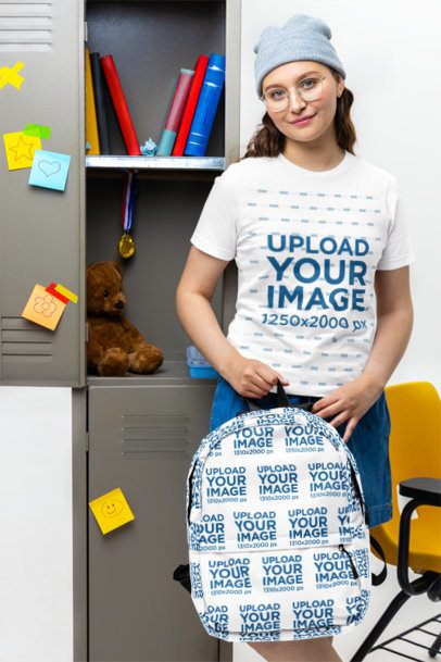 Bella Canvas Tee Mockup Featuring a Young Woman Posing Against School Lockers With a Backpack m57195