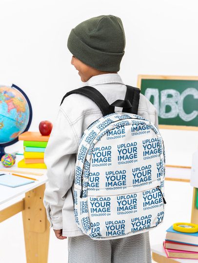 Mockup of a Boy Carrying a Backpack on His Back in a Classroom-Themed Setting