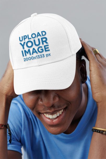 Embroidered Dad Hat Mockup Featuring a Cheerful Man Posing in a Studio