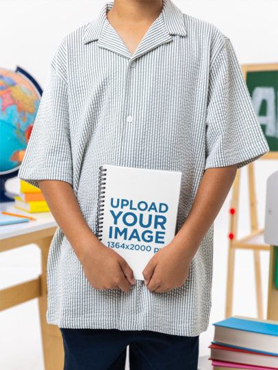 School-Themed Mockup Featuring a Cropped-Face Boy Holding a Notebook m57000
