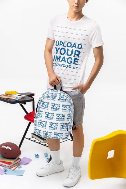 Bella Canvas T-Shirt Mockup Featuring a Cropped-Face Young Man Carrying a Backpack