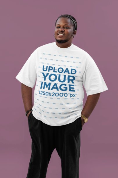 Oversized T-Shirt Mockup of a Smiling Bearded Man Standing Against a Customizable Backdrop