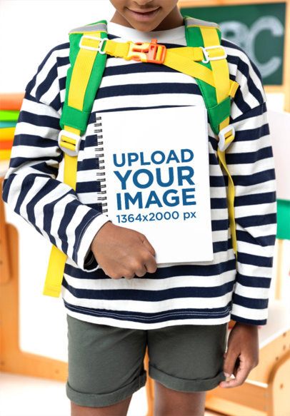 Spiral Notebook Mockup Featuring a Smiling Cropped-Face Girl in a Classroom Set m57003