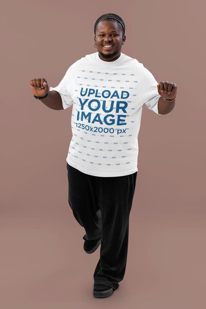 Mockup of a Happy Bearded Man Dancing in a Studio and Wearing an Oversized T-Shirt