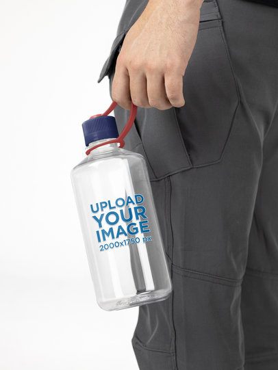 Mockup of a Person Holding a Nalgene Water Bottle in a Studio m55024