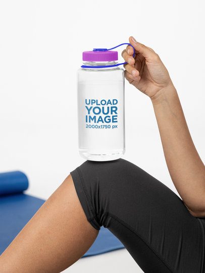 Mockup of a Woman Holding a Nalgene Water Bottle With Her Knee m55028