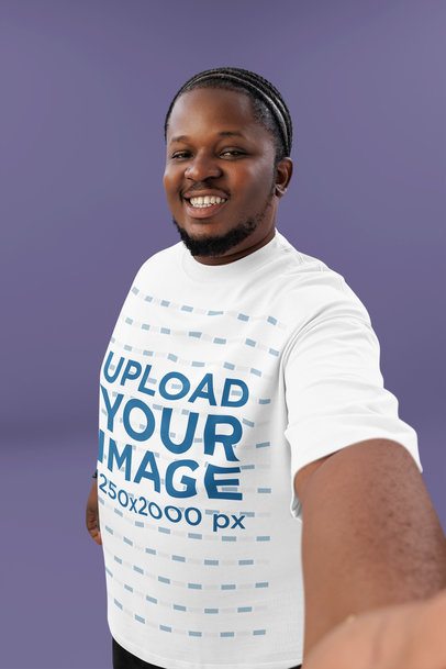 Oversized Tee Mockup Featuring a Cheerful Bearded Man Taking a Selfie in a Studio
