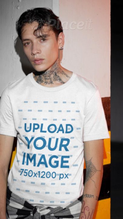Bella Canvas T-Shirt Video Featuring a Tattooed Man With a Gothic Style Posing in a Parking Lot
