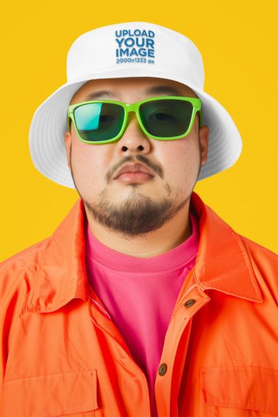 Embroidered Bucket Hat Mockup of an AI-Generated Bearded Man Posing in a Studio