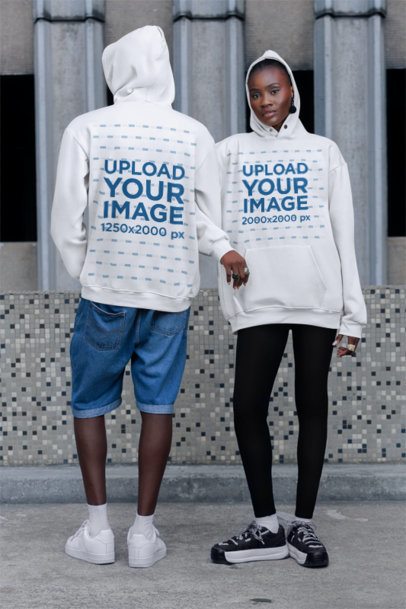 Pullover Hoodie Mockup of a Serious Woman Posing Next to a Man in the Street