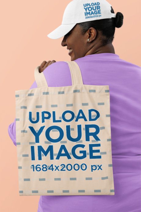 Dad Hat Mockup Featuring a Happy Woman Carrying a Tote Bag in a Studio
