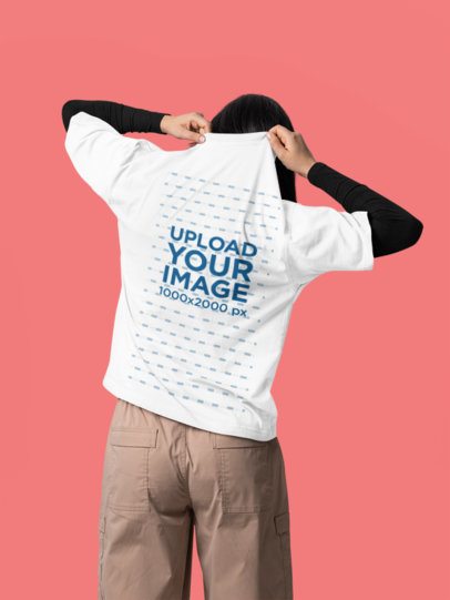Back-View Oversized T-Shirt Mockup of a Woman Standing in a Studio Setting m57409